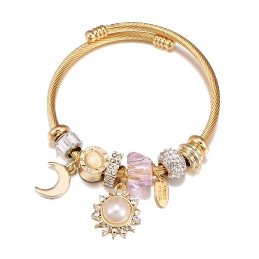 Χρυσό βραχιόλι cuff με charms ήλιο, φεγγάρι και πέτρες